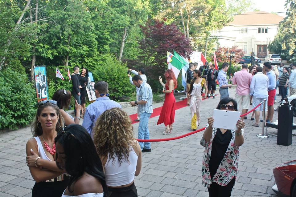 Red carpet fashion event with models and guests, hair styled by Hair Care Studios