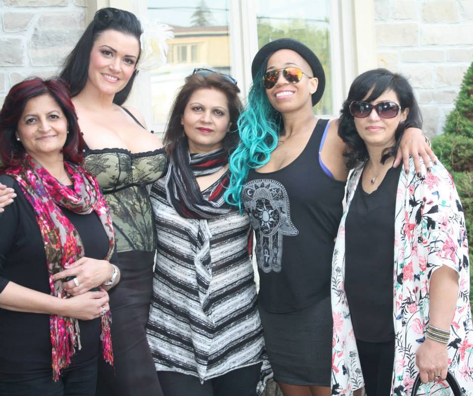 Gul with her team and community, diverse group with creative hair styling