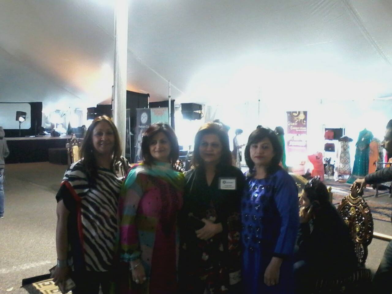 Gul backstage styling a model with a glamorous blonde blowout for a fashion event