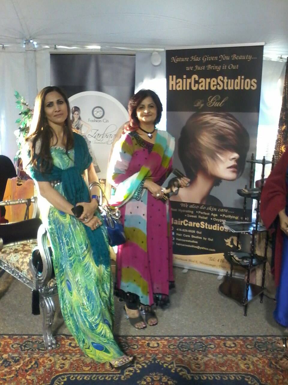 Hair Care Studios trade show booth with branded signage and display